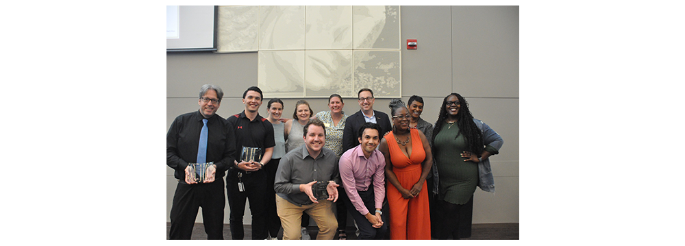 A group of staff members including Nick Jones (far left), member of ITS, receiving the Staff Member Of The Year award.